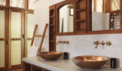 One of the sumptuously appointed bathrooms in Tartaruga private villa on Vamizi Island.