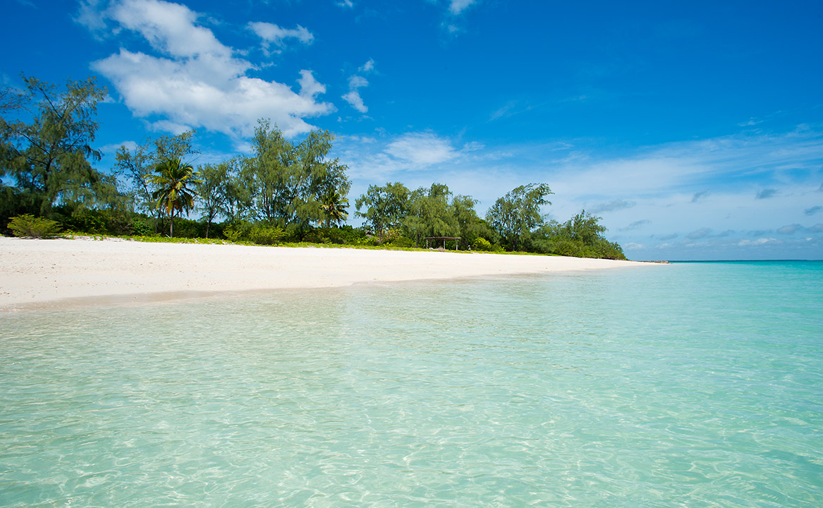 One the 10 secluded beach villas in the Vamizi Island Lodge as seen from the warm waters of the Indian Ocean.