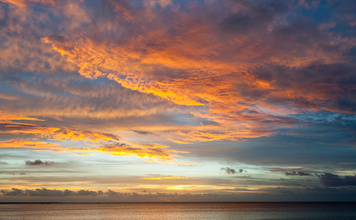 A glorious red sunset over the Indian Ocean off the coast of Vamizi Island.