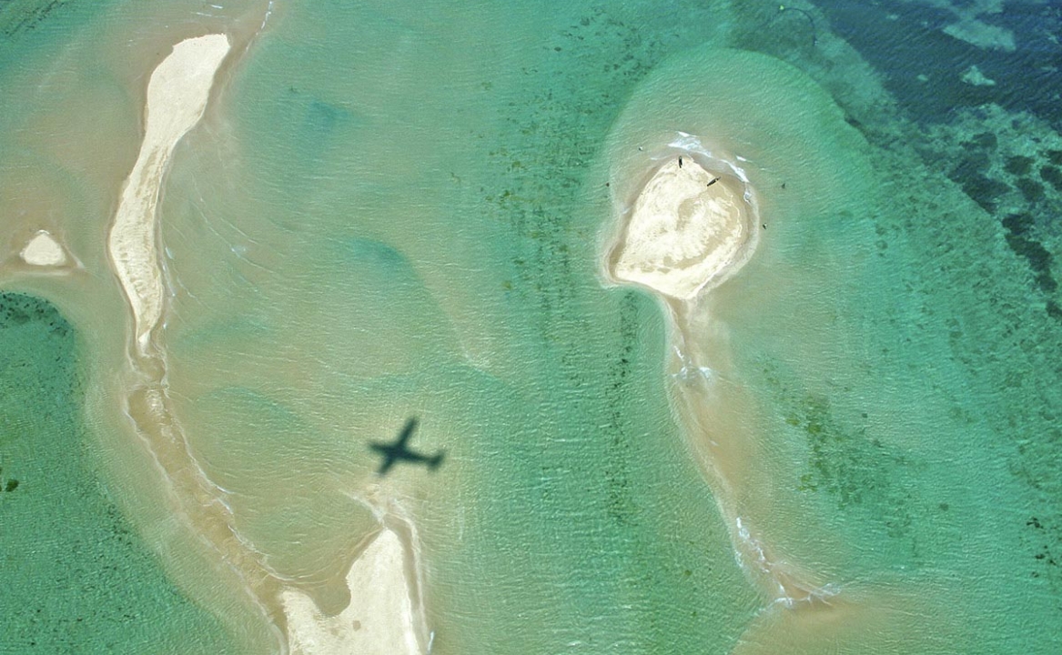 An aerial view of the shallows and sand bars off the beaches of Vamizi Island.